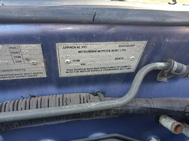 A Blue Car With a License Plate That Says Mitsubishi Motors — South West 4WD Wreckers In Brisbane, QLD