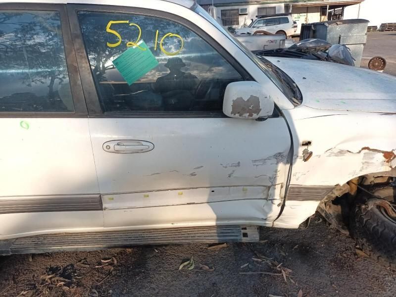 A White Car With the Number 52.10 on the Door — South West 4WD Wreckers In Harristown, QLD