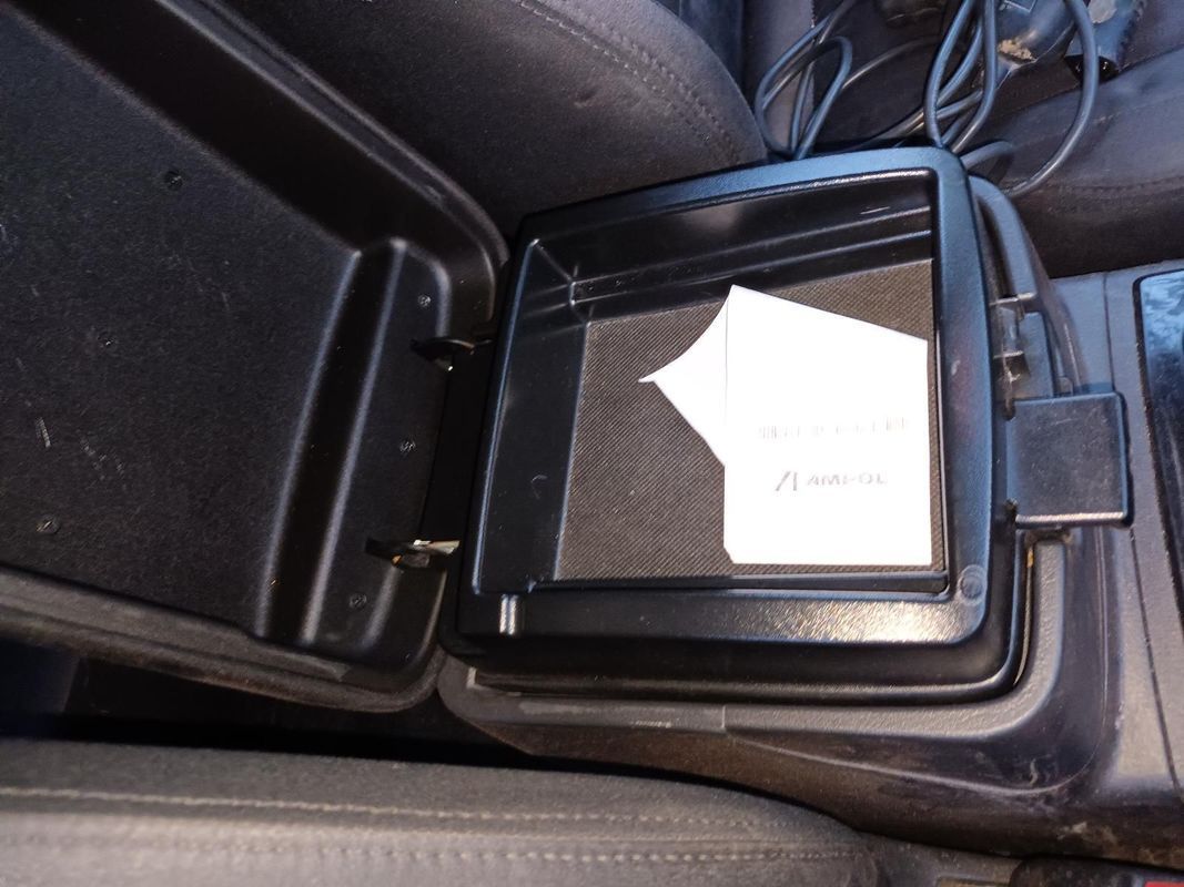 A Car Console With the Lid Open and a Piece of Paper in It — South West 4WD Wreckers In Brisbane, QLD