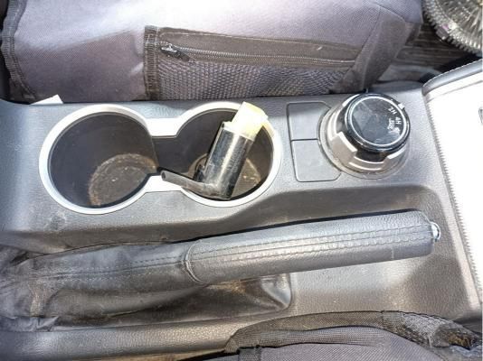A Car Console With Two Cup Holders and a Handbrake — South West 4WD Wreckers In Harristown, QLD