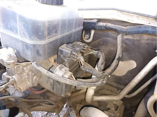 A Close Up of a Car Engine With a Hose Attached to It — South West 4WD Wreckers In Harristown, QLD