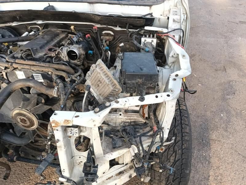 A White Car With the Hood Up and a Lot of Wires Coming Out of It — South West 4WD Wreckers In Brisbane, QLD