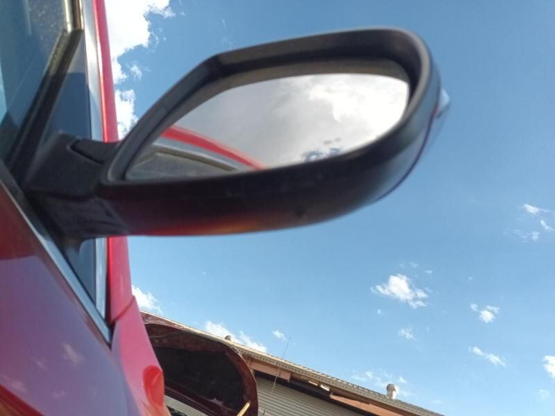 A Side View Mirror on a Red Car With a Blue Sky in the Background — South West 4WD Wreckers In Brisbane, QLD