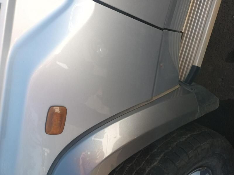 A Close Up of the Fender of a Silver Car — South West 4WD Wreckers In Harristown, QLD