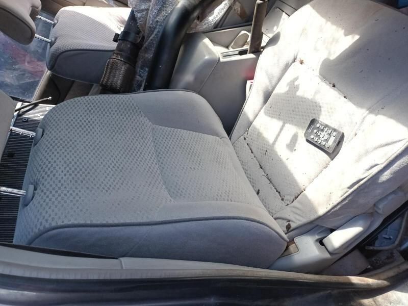 A Car Seat With a Remote Control on It — South West 4WD Wreckers In Harristown, QLD