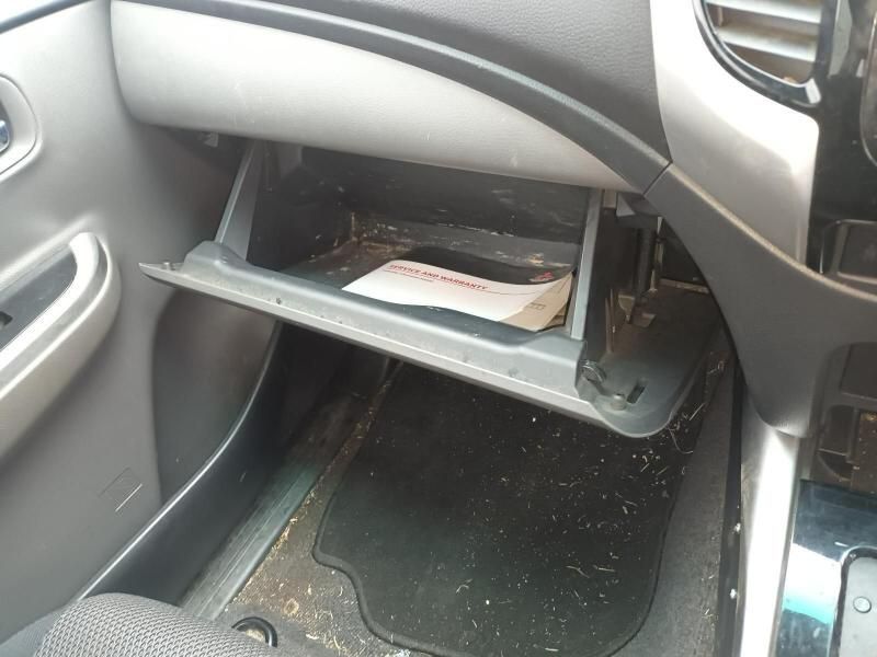 A Car Glovebox With a Piece of Paper in It — South West 4WD Wreckers In Brisbane, QLD