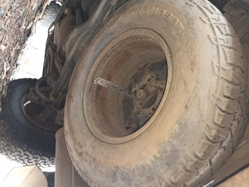 A Close Up of a Tire With a Chain Attached to It — South West 4WD Wreckers In Harristown, QLD