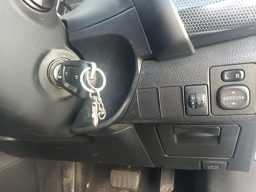 A Close Up of a Car Dashboard with a Key in the Ignition — South West 4WD Wreckers in Harristown, QLD