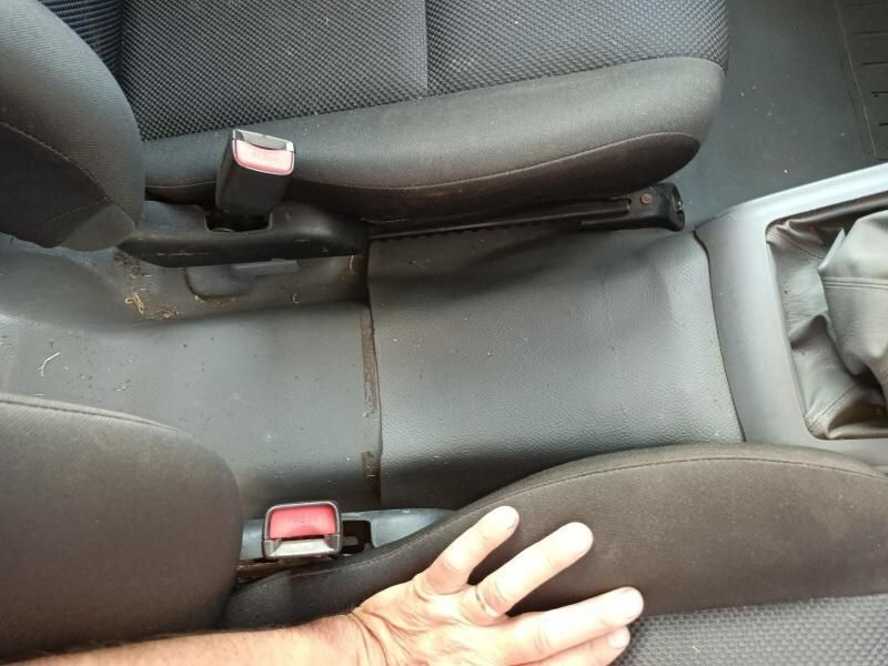 A Man 's Hand Rests on the Back Seat of a Car — South West 4WD Wreckers In Harristown, QLD