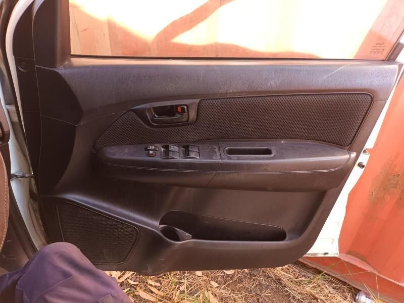 A Person is Sitting in the Door of a White Car — South West 4WD Wreckers In Harristown, QLD