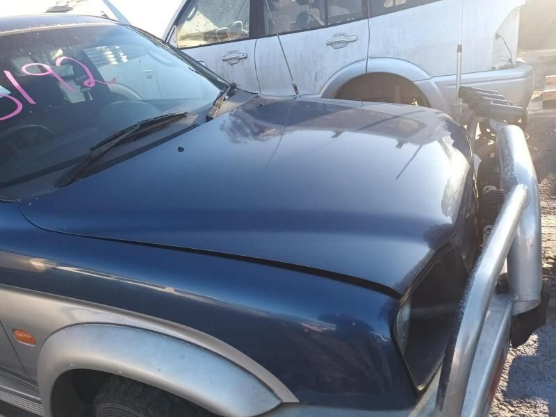 A Blue Car With the Number 319 on the Hood — South West 4WD Wreckers In Brisbane, QLD