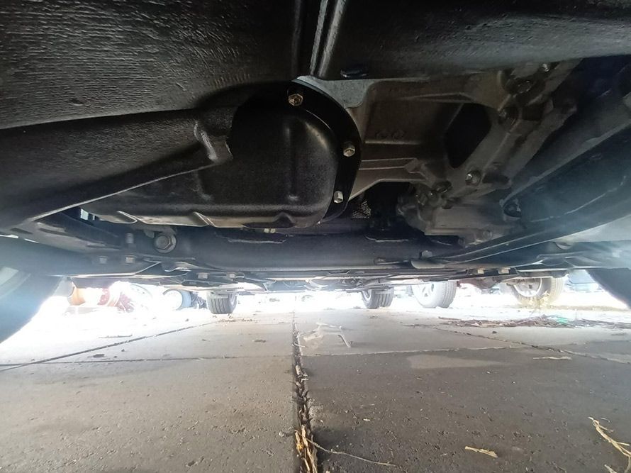 The Underside of a Car Parked on the Side of the Road — South West 4WD Wreckers in Harristown, QLD