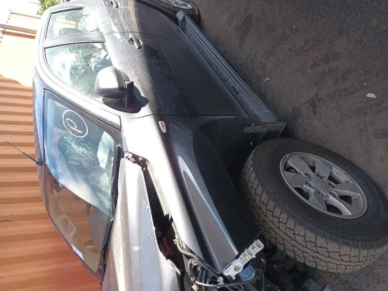 A Damaged Car is Parked on the Side of the Road — South West 4WD Wreckers In Harristown, QLD