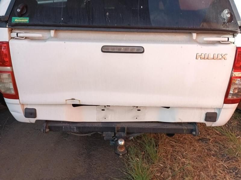 The Back End of a White Toyota Hilux Truck is Shown — South West 4WD Wreckers In Harristown, QLD
