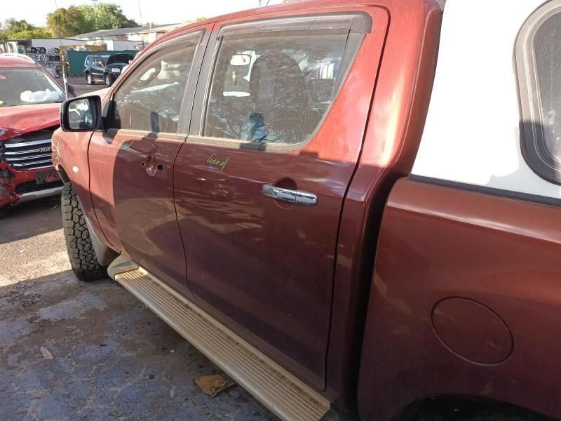 A Red Truck is Parked on the Side of the Road — South West 4WD Wreckers In Harristown, QLD