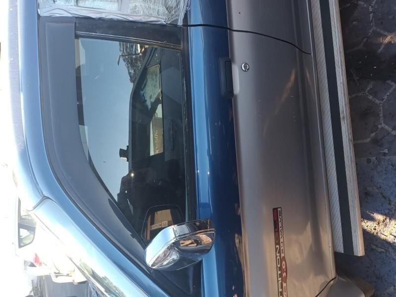 A Blue and Silver Truck is Parked on the Side of the Road — South West 4WD Wreckers In Brisbane, QLD
