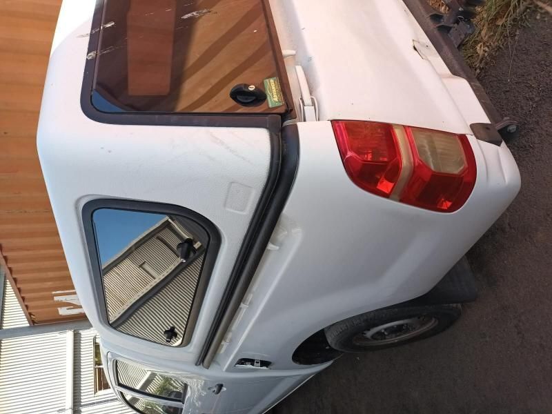 A White Truck With a Canopy is Parked on the Side of the Road — South West 4WD Wreckers In Harristown, QLD