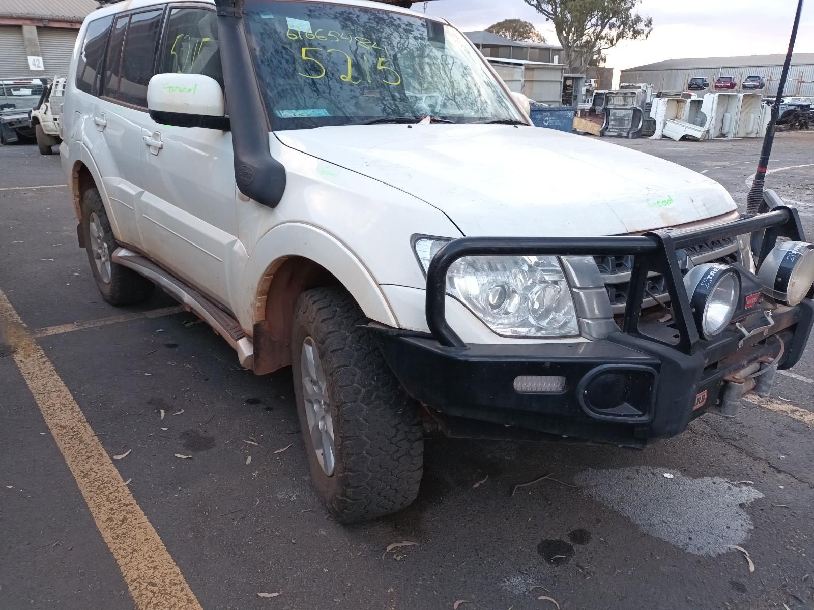 A White Suv With a Snorkel is Parked in a Parking Lot — South West 4WD Wreckers In Brisbane, QLD