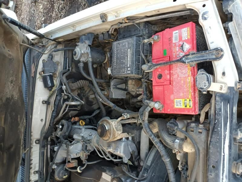 A White Car With a Red Battery in the Engine Compartment — South West 4WD Wreckers In Harristown, QLD