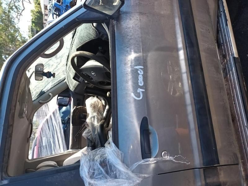 A Car is Sitting on the Ground With the Door Open — South West 4WD Wreckers In Harristown, QLD