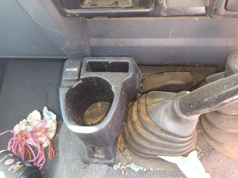 A Cup Holder is Sitting Next to a Shifter in a Car — South West 4WD Wreckers In Harristown, QLD
