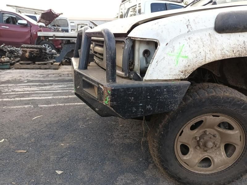 A White Truck With a Black Bumper is Parked in a Parking Lot — South West 4WD Wreckers In Brisbane, QLD