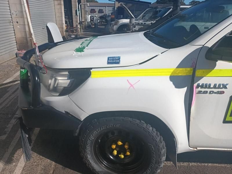 A White Hilux Truck is Parked in a Parking Lot — South West 4WD Wreckers In Brisbane, QLD