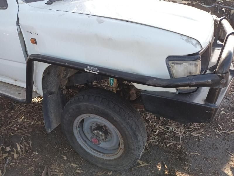 A White Truck With a Black Bumper is Parked on the Ground — South West 4WD Wreckers In Brisbane, QLD