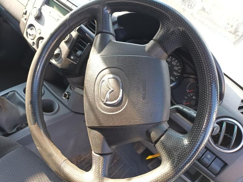A Black Steering Wheel With a Mazda Logo on It — South West 4WD Wreckers In Harristown, QLD