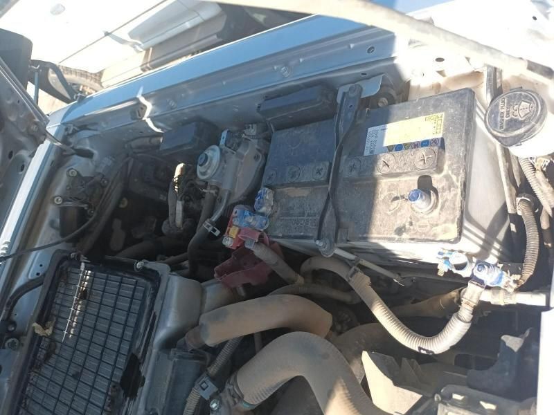 The Engine of a Car is Shown With the Battery Visible — South West 4WD Wreckers In Harristown, QLD