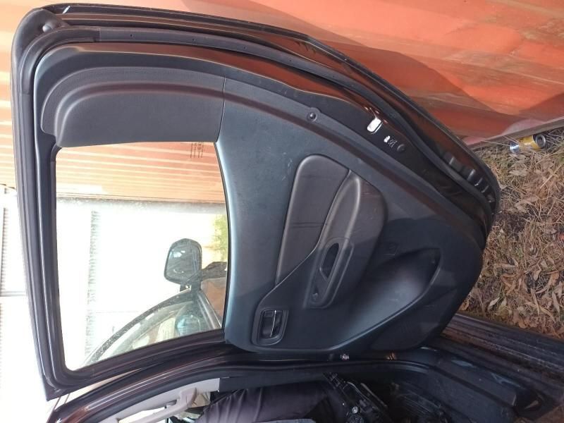 The Back Door of a Black Car is Open — South West 4WD Wreckers In Harristown, QLD