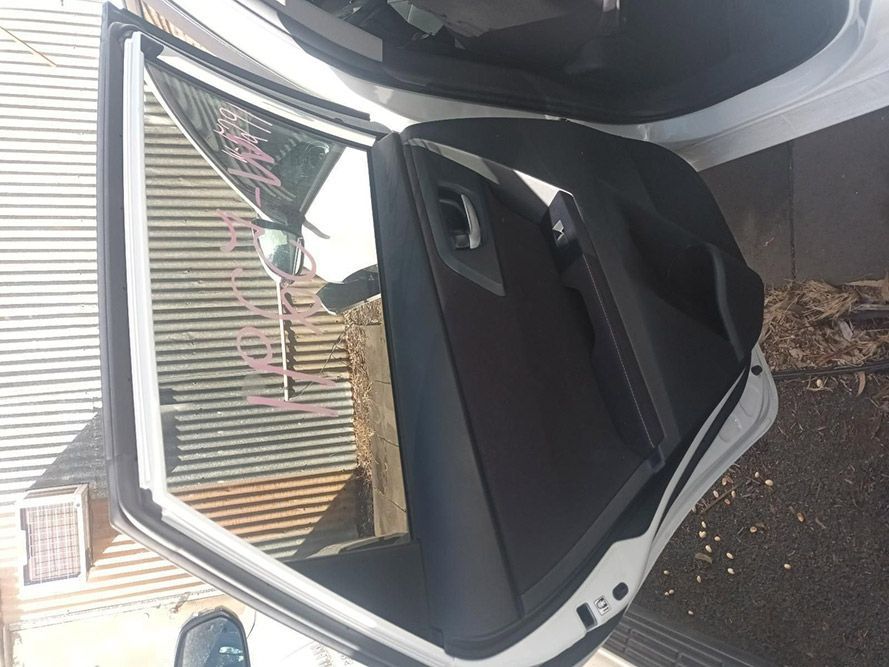 The Back Door of a White Car is Open — South West 4WD Wreckers in Harristown, QLD