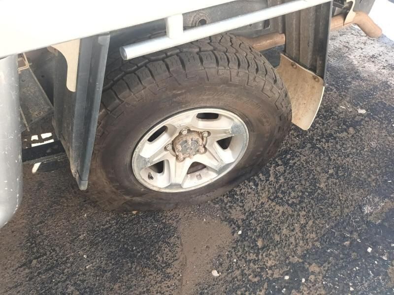 A Close Up of a Tire on a Truck on a Dirt Road — South West 4WD Wreckers In Harristown, QLD