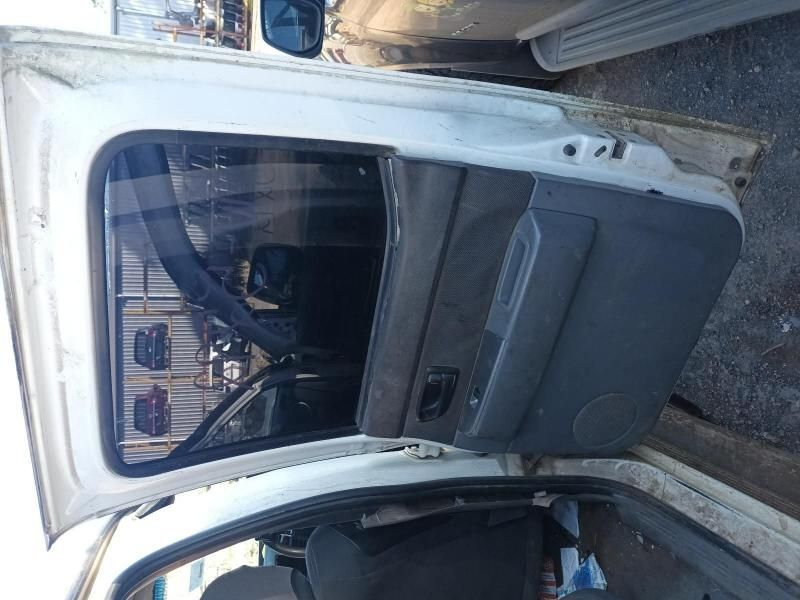 A White Car With the Door Open is Parked on the Side of the Road — South West 4WD Wreckers In Harristown, QLD