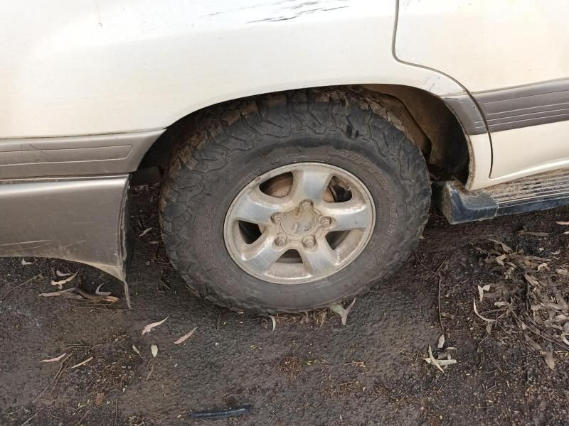 A Close Up of a Car Wheel on a Dirt Road — South West 4WD Wreckers In Harristown, QLD
