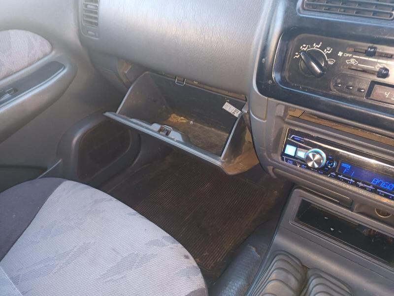A Close Up View of a Car Dashboard With Radio and Open Drawer — South West 4WD Wreckers In Brisbane, QLD