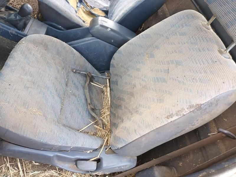 A Pair of Dirty Car Seats Are Sitting in the Back of a Car — South West 4WD Wreckers In Brisbane, QLD