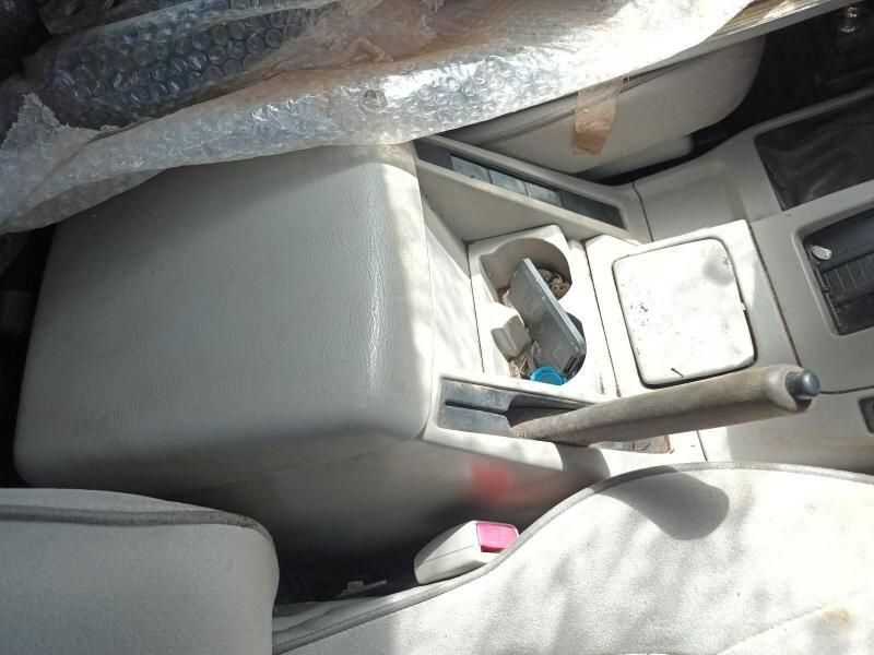 A Car Console With a Cup Holder and a Shifter — South West 4WD Wreckers In Harristown, QLD