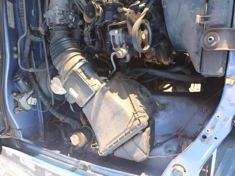 A Close Up of the Engine of a Blue Car — South West 4WD Wreckers In Brisbane, QLD