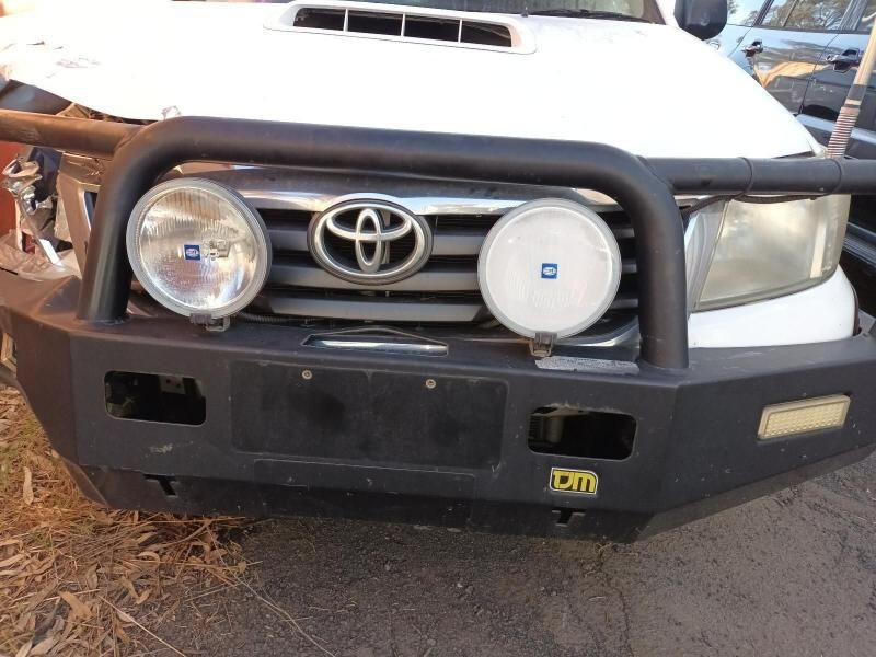 A White Toyota With a Black Bumper and Lights — South West 4WD Wreckers In Harristown, QLD