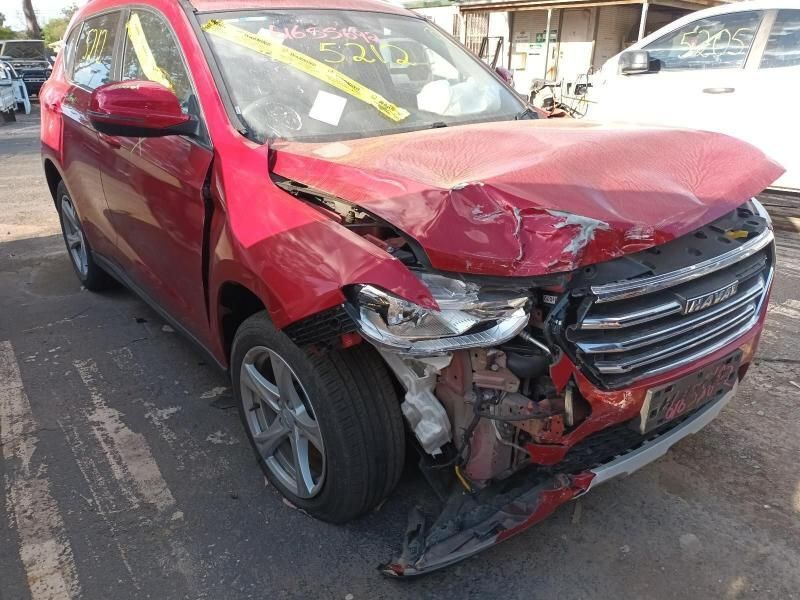 A Red Car With a Damaged Front End is Parked on the Side of the Road — South West 4WD Wreckers In Brisbane, QLD