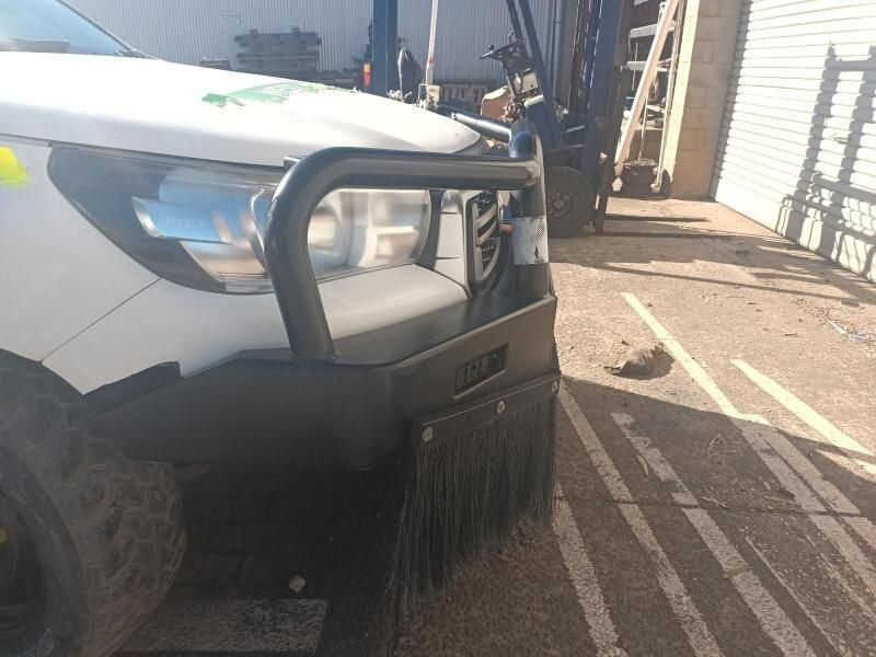 A White Truck With a Black Bumper is Parked in a Parking Lot — South West 4WD Wreckers In Brisbane, QLD