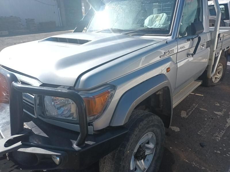 A Silver Truck With a Black Bumper is Parked on the Side of the Road — South West 4WD Wreckers In Harristown, QLD
