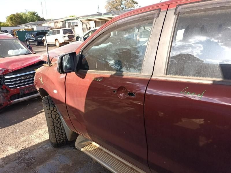 A Red Car is Parked in a Lot With Other Cars — South West 4WD Wreckers In Harristown, QLD