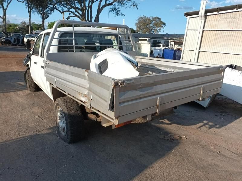 A White Truck With a Tray on the Back is Parked in a Parking Lot — South West 4WD Wreckers In Harristown, QLD