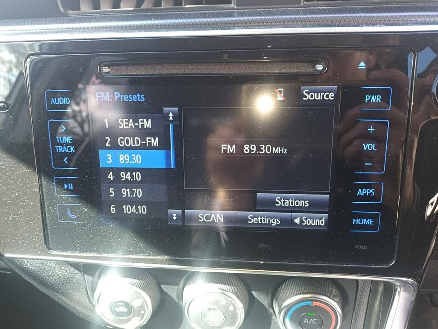 A Close Up of a Car's Dashboard Shows Fm Presets — South West 4WD Wreckers in Harristown, QLD