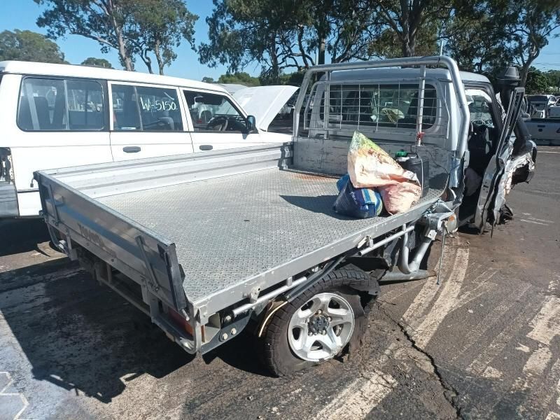 A Pickup Truck With a Flat Bed is Parked in a Parking Lot — South West 4WD Wreckers In Harristown, QLD