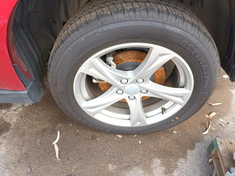 A Close Up of a Tire on a Red Car — South West 4WD Wreckers In Brisbane, QLD