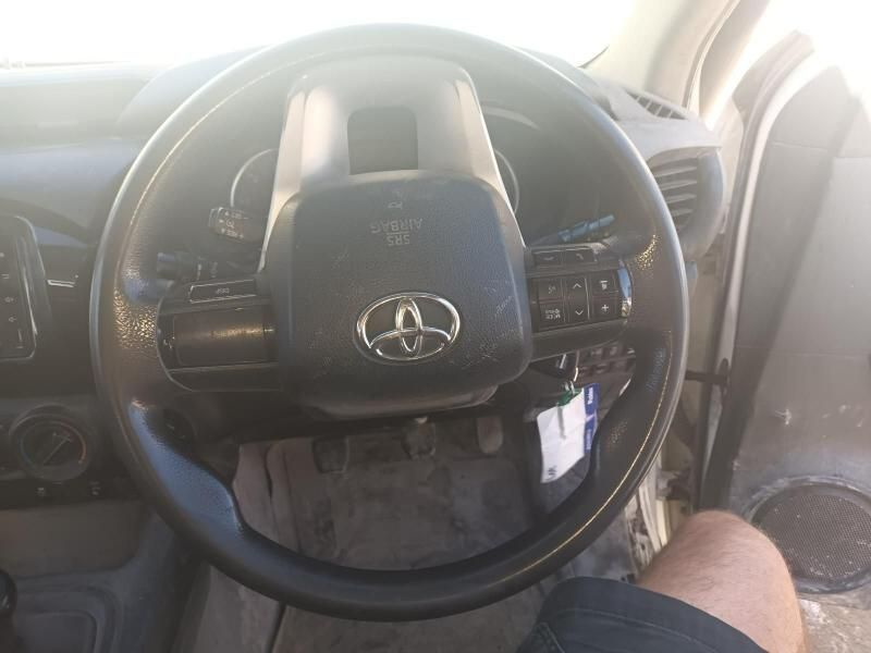 A Person is Sitting in the Driver 's Seat of a Toyota Car — South West 4WD Wreckers In Brisbane, QLD