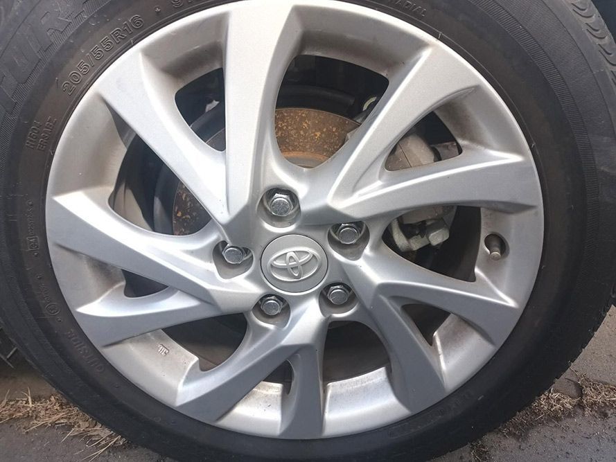 A Close Up of a Car Wheel with a Toyota Logo on It — South West 4WD Wreckers in Harristown, QLD